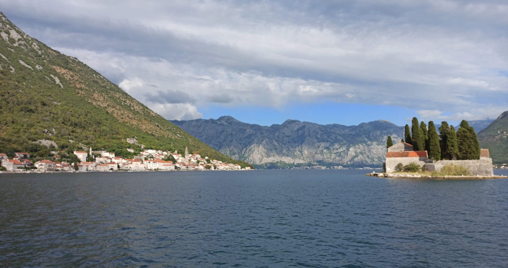 Our Lady of the Rocks the view from the island to Perast and the island in front of it