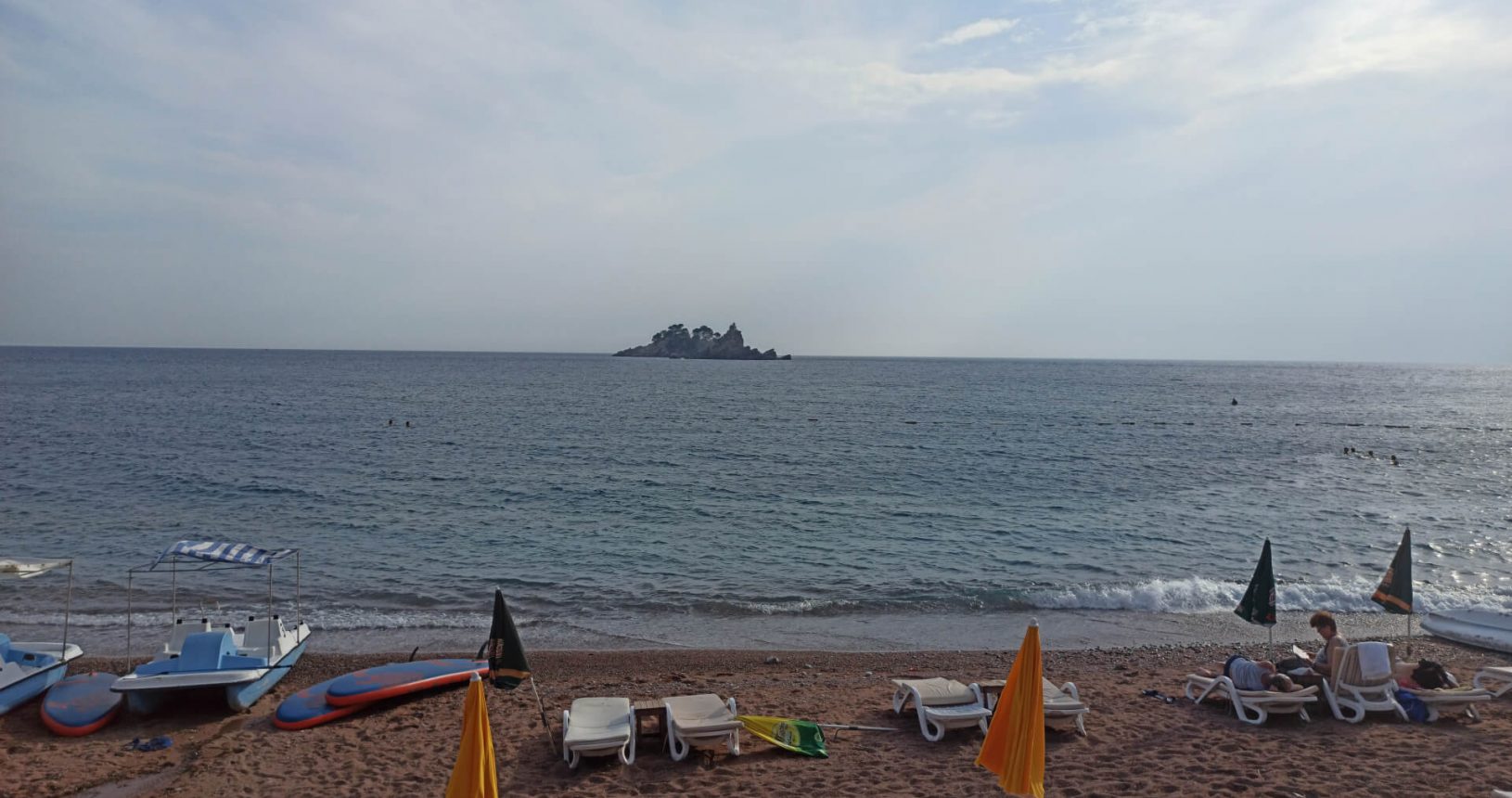 View to the island from the beach in Petrovac