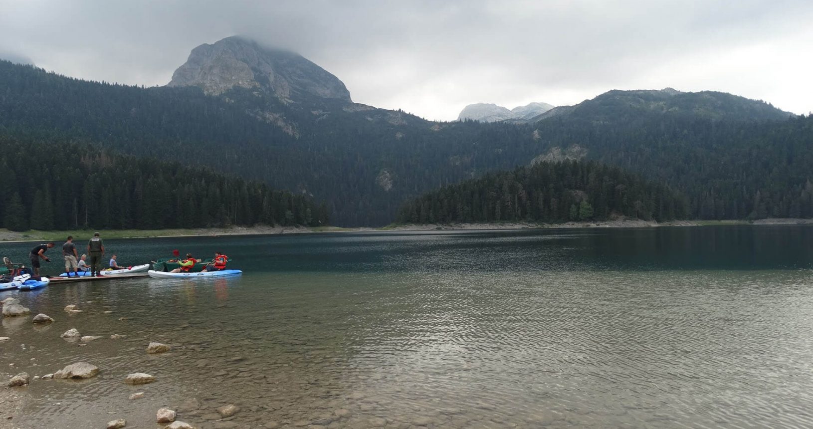 Riding a boat on the black lake National Park Durmitor