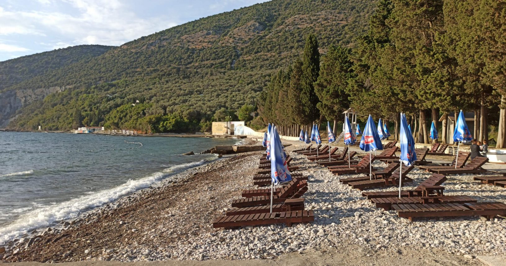 Sunbeds and umbrellas on Valdanos beach