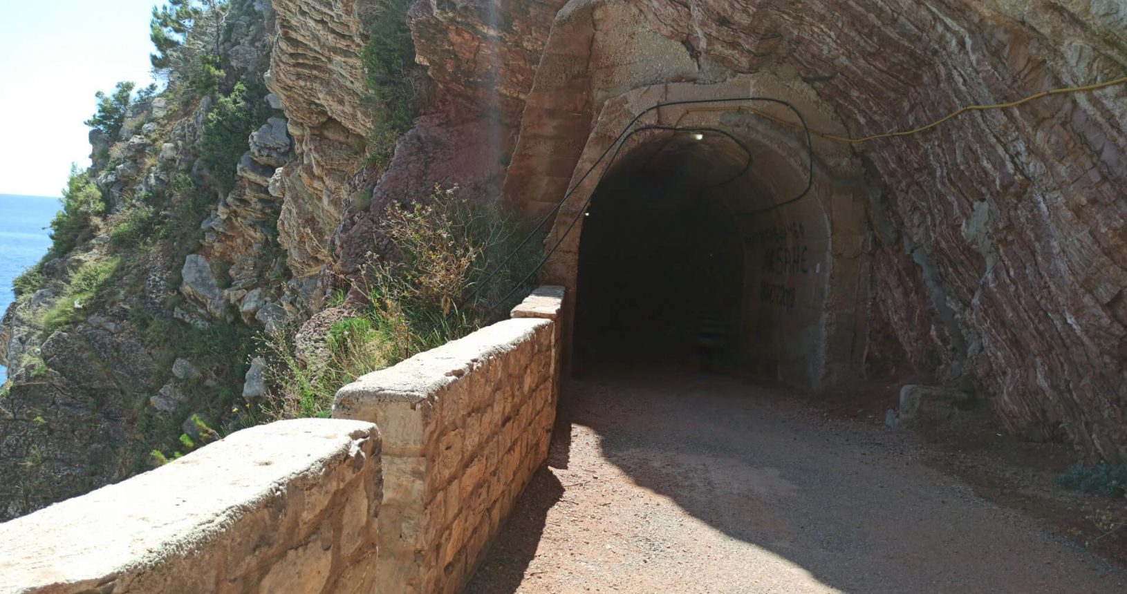 Tunnel and rocks. Walking Trail Petrovac Rezevici