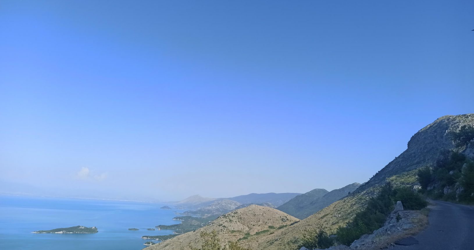Blue lake and the road. Skadar lake