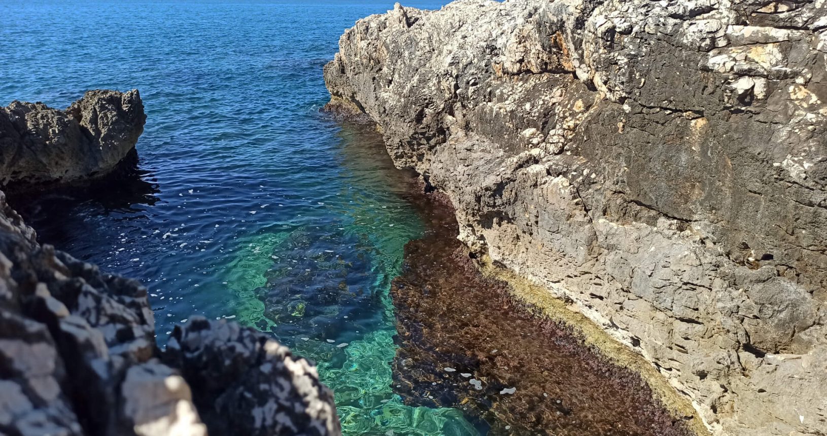 Clear transparent turquoise blue sea on Hladna Uvala