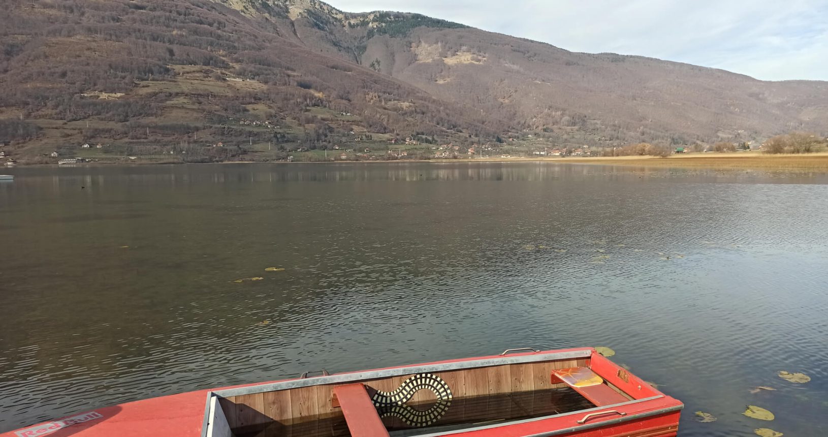 Lovely red boat in Plav lake