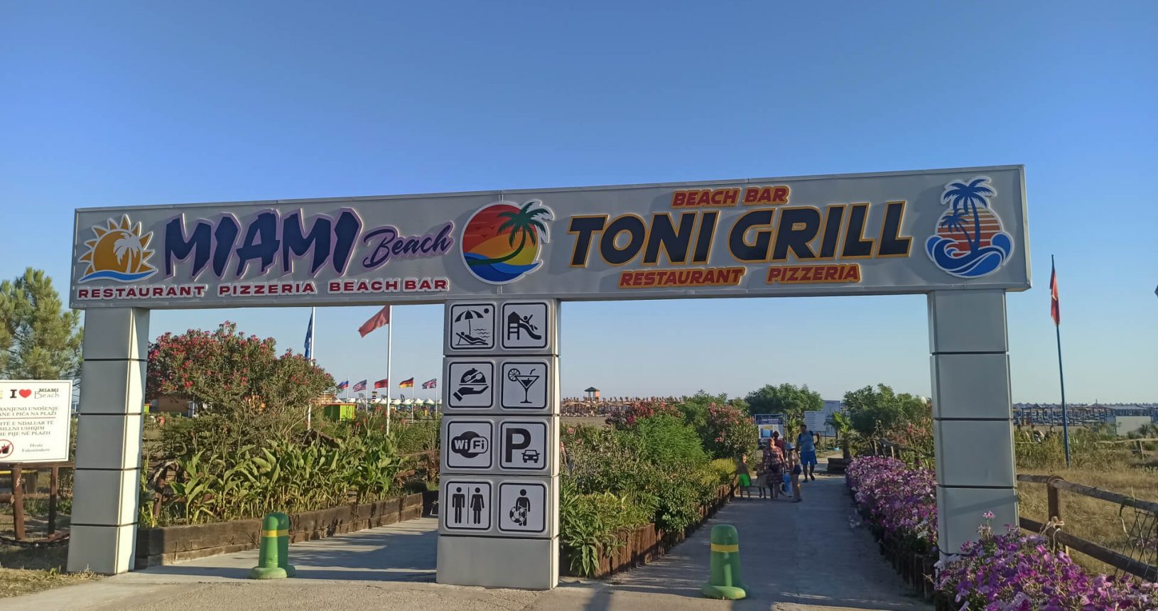 Miami beach and Toni Grill Beach sign and entrance