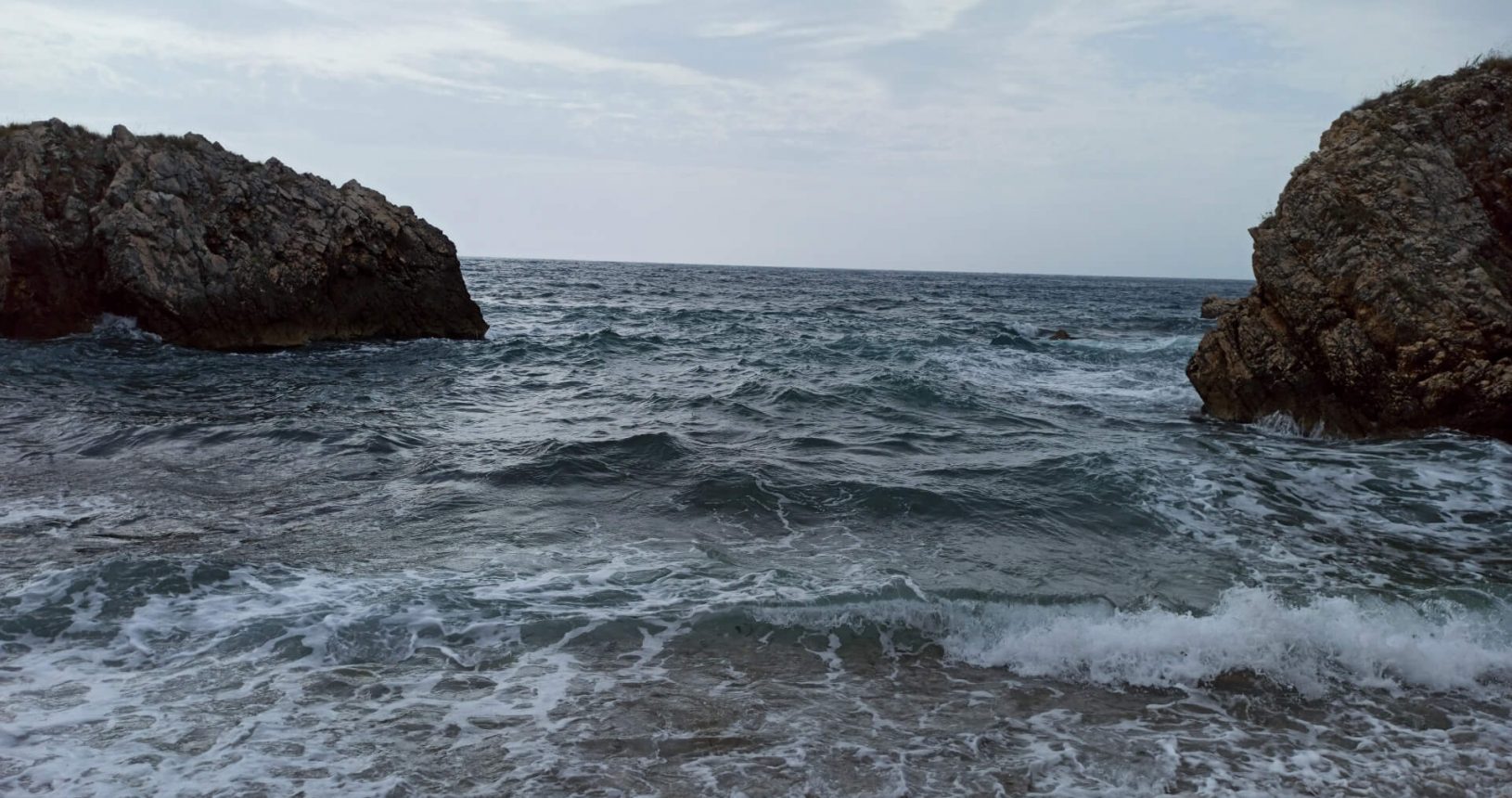 Utjeha nude beach with waves