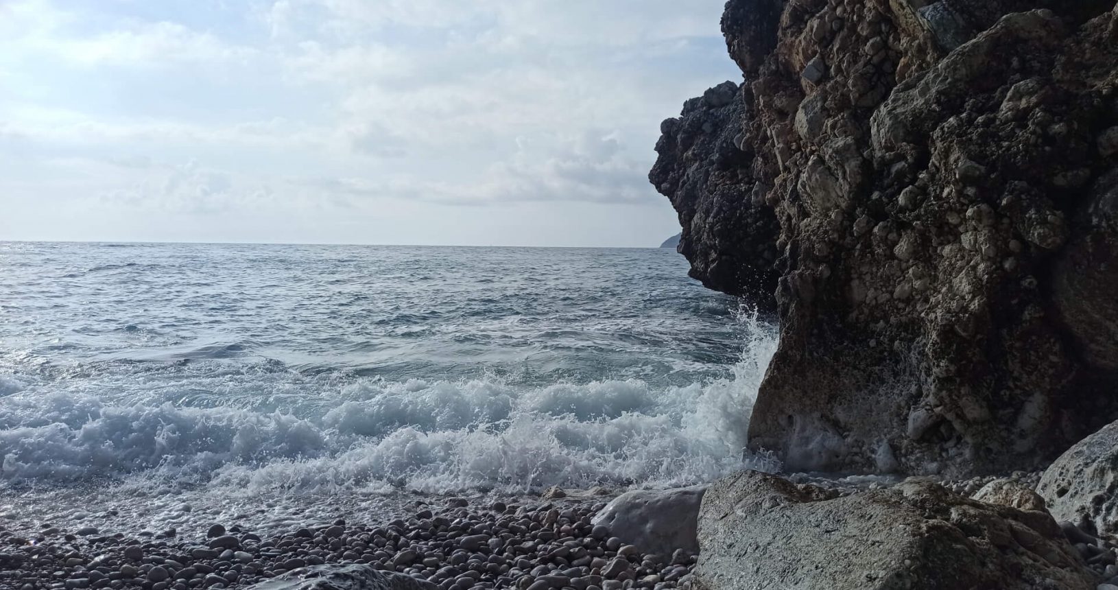 Waves on the rocks. FKK Sutomore Beach