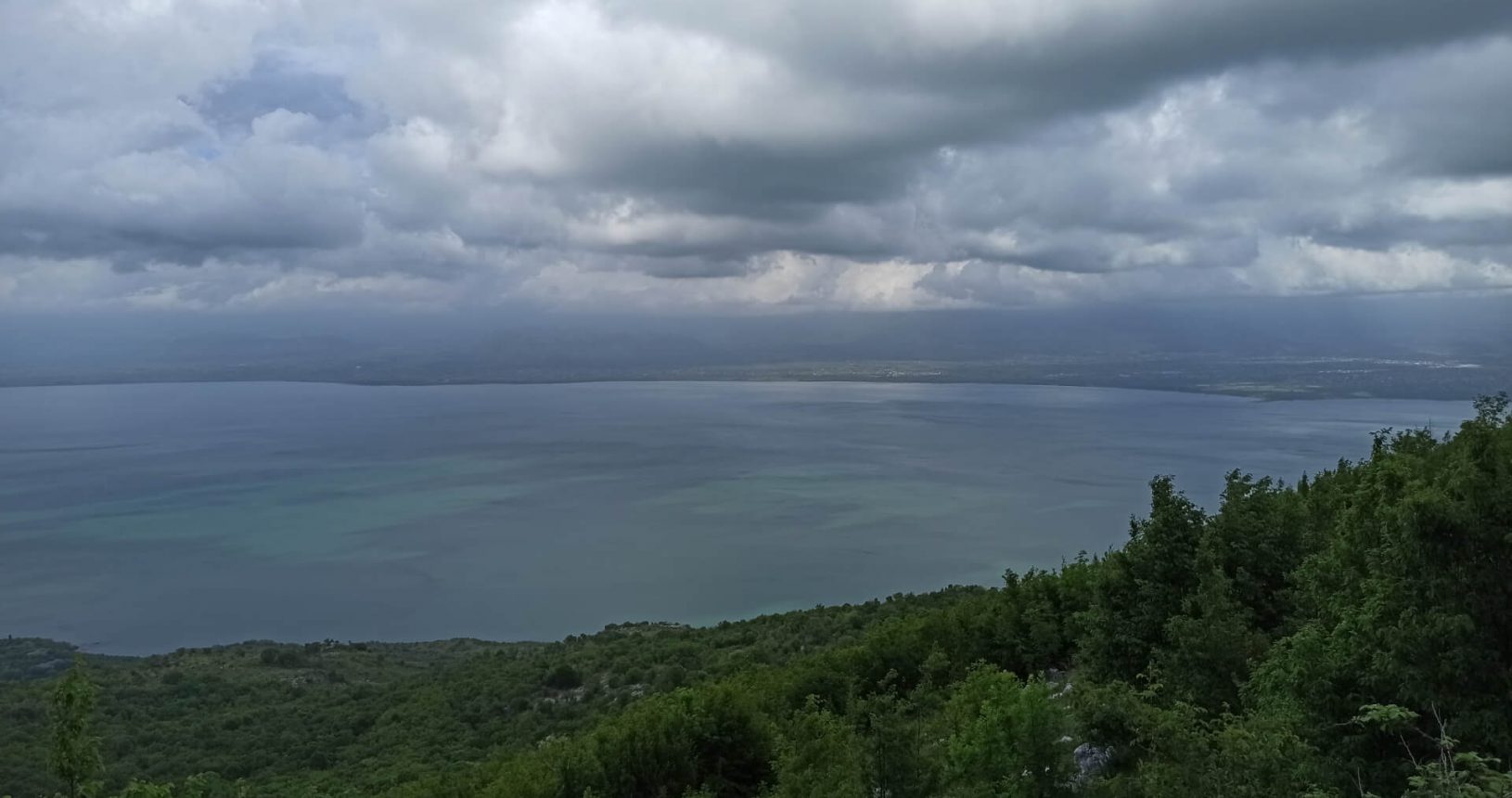 Amazing different colours of the lake and Albania from the other side. Viewpoint Shtegvashe