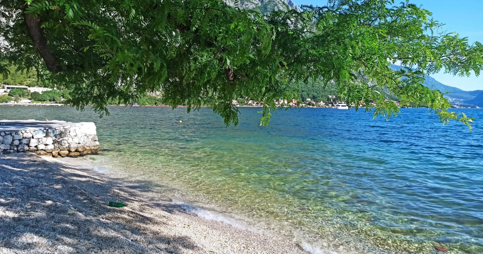 Green trees and turquoise sea. Orahovac beach