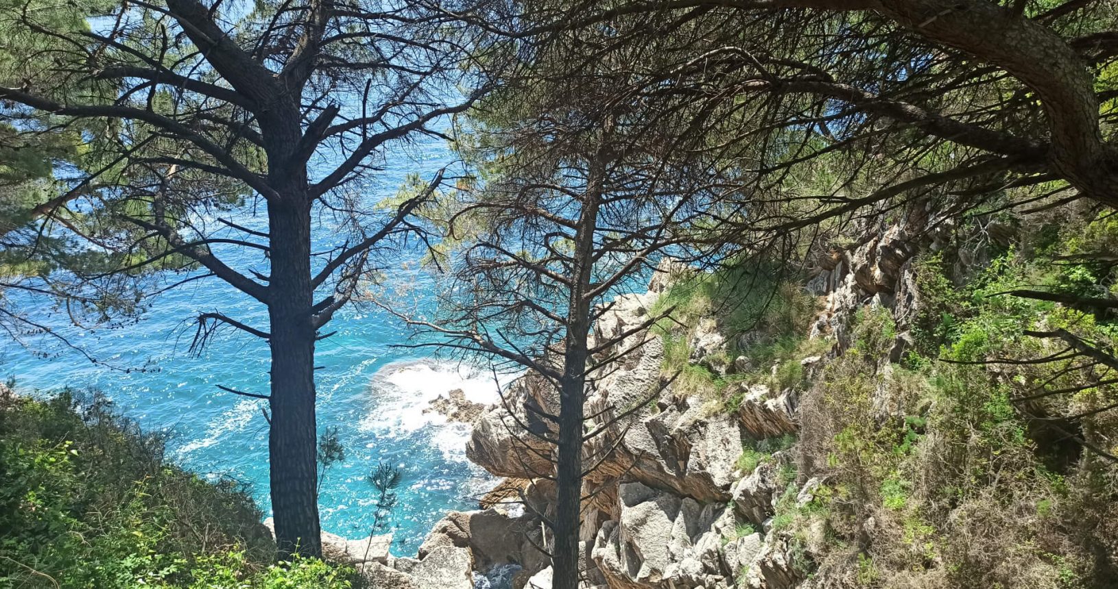 Lovely rocks in turquoise sea. Walking trail Petrovac Rezevici