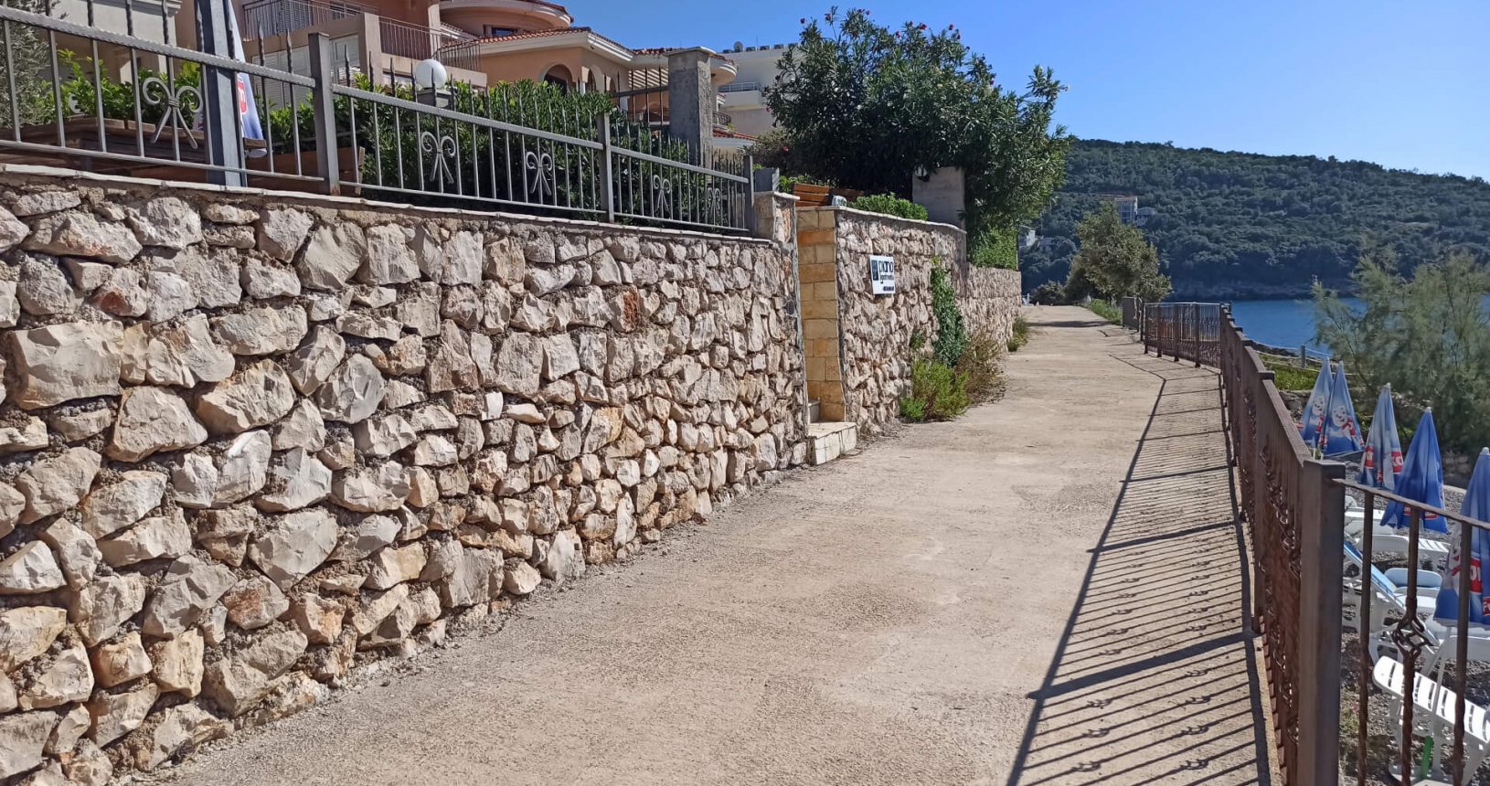 Cozy stony promenade between villas and sea Hladna Uvala