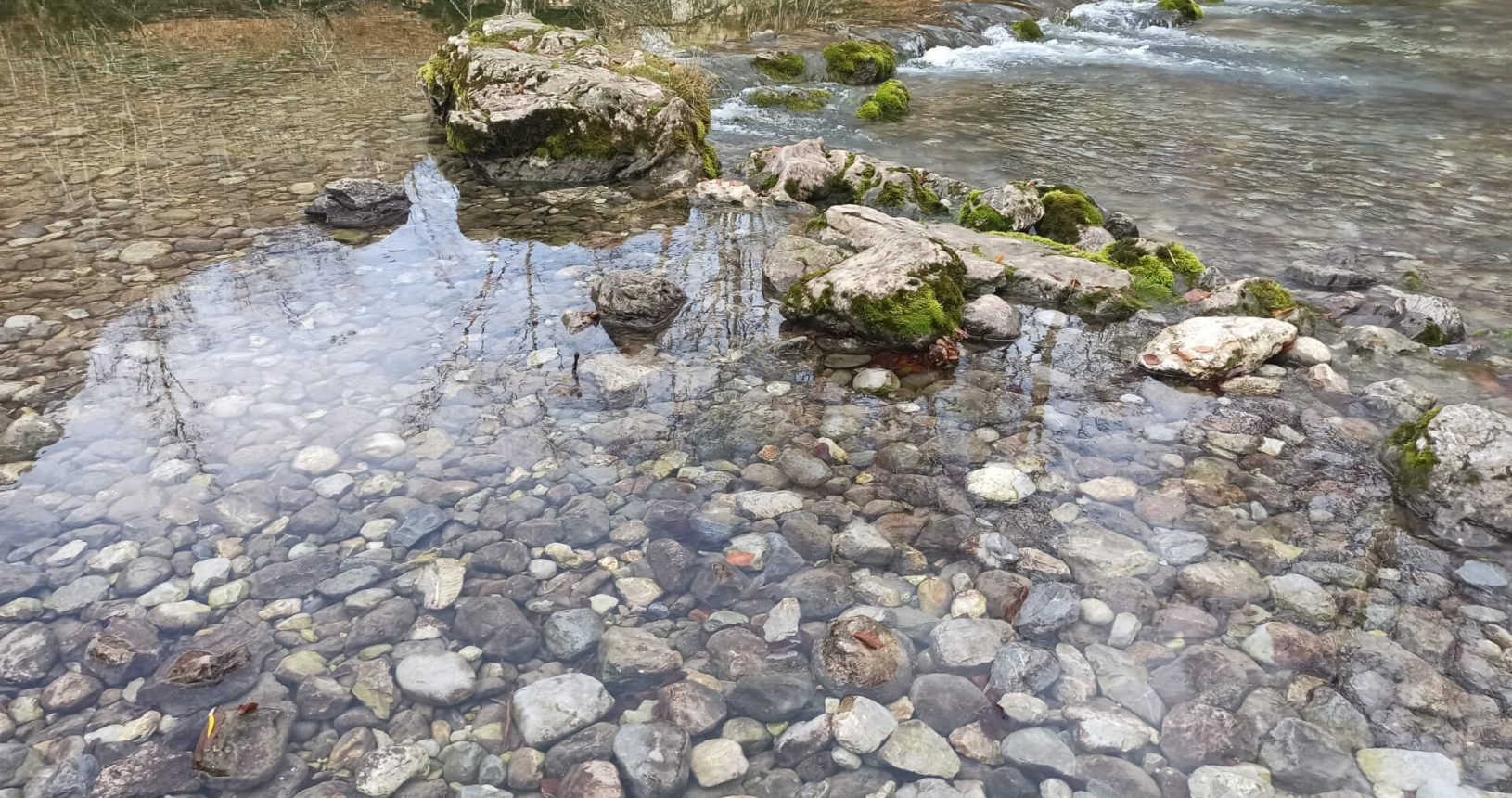 Clear water in the mountain river at The eye of a grasshopper