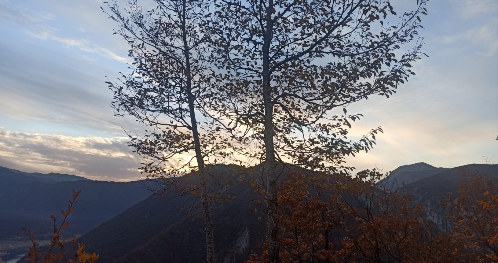 Mountains and trees at sunset Piva lake observation platform