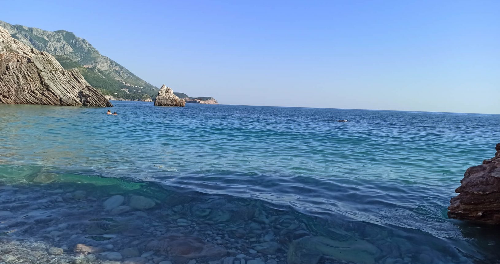 Blue sea at Rafailovici rocky beach