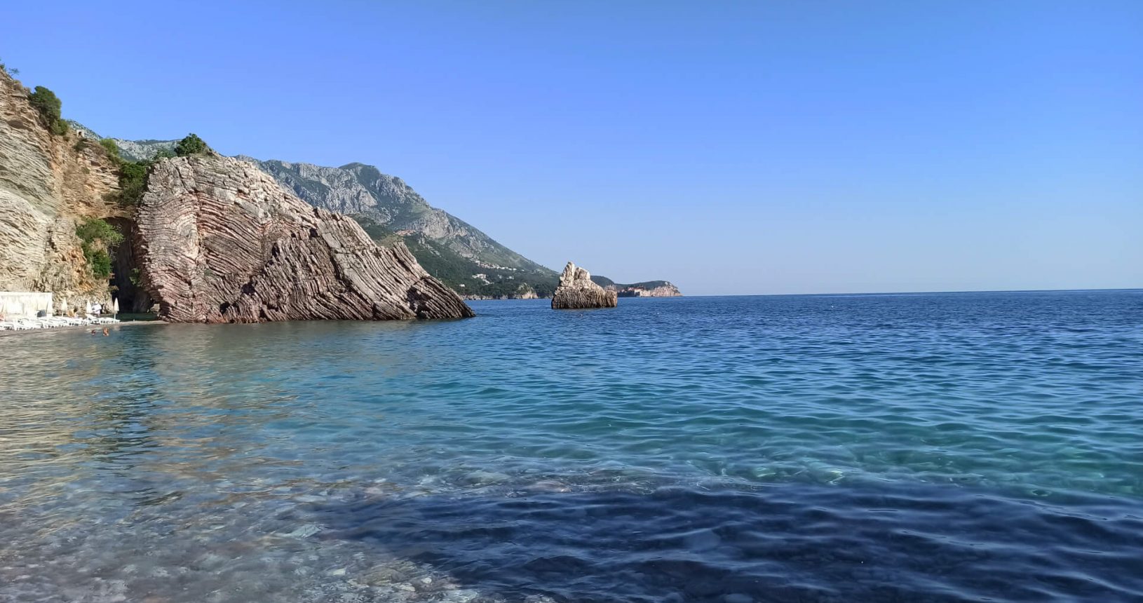 Incredible transparent water and view at Rafailovici rocky beach