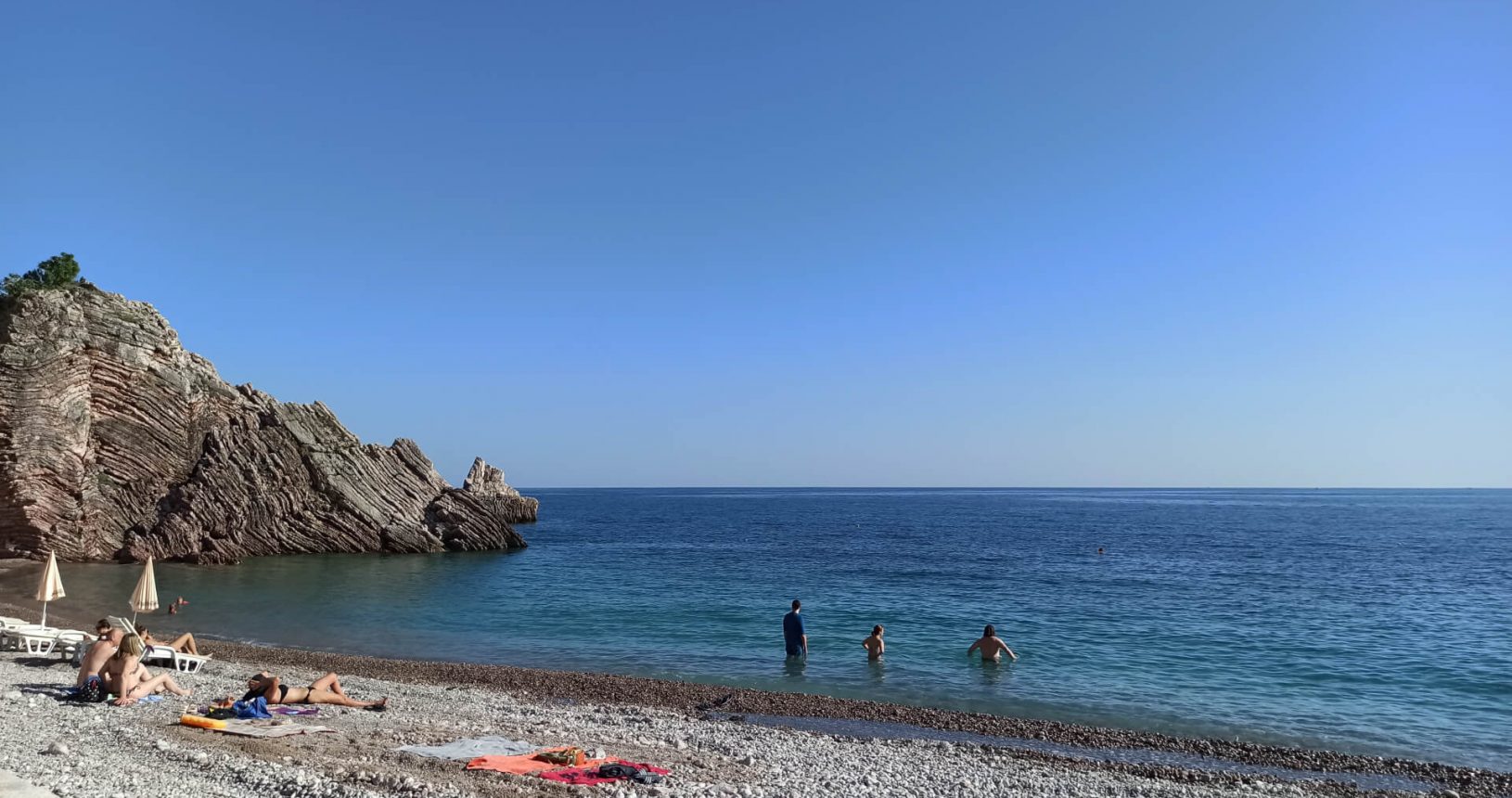 Peaceful blue sea at Rafailovici rocky beach