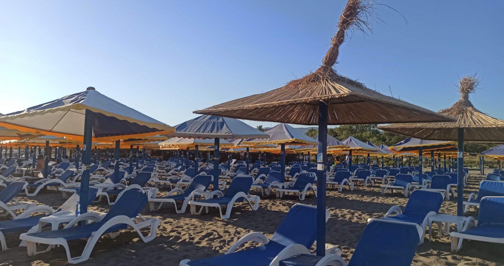 Toni Grill Beach loungers and umbrellas