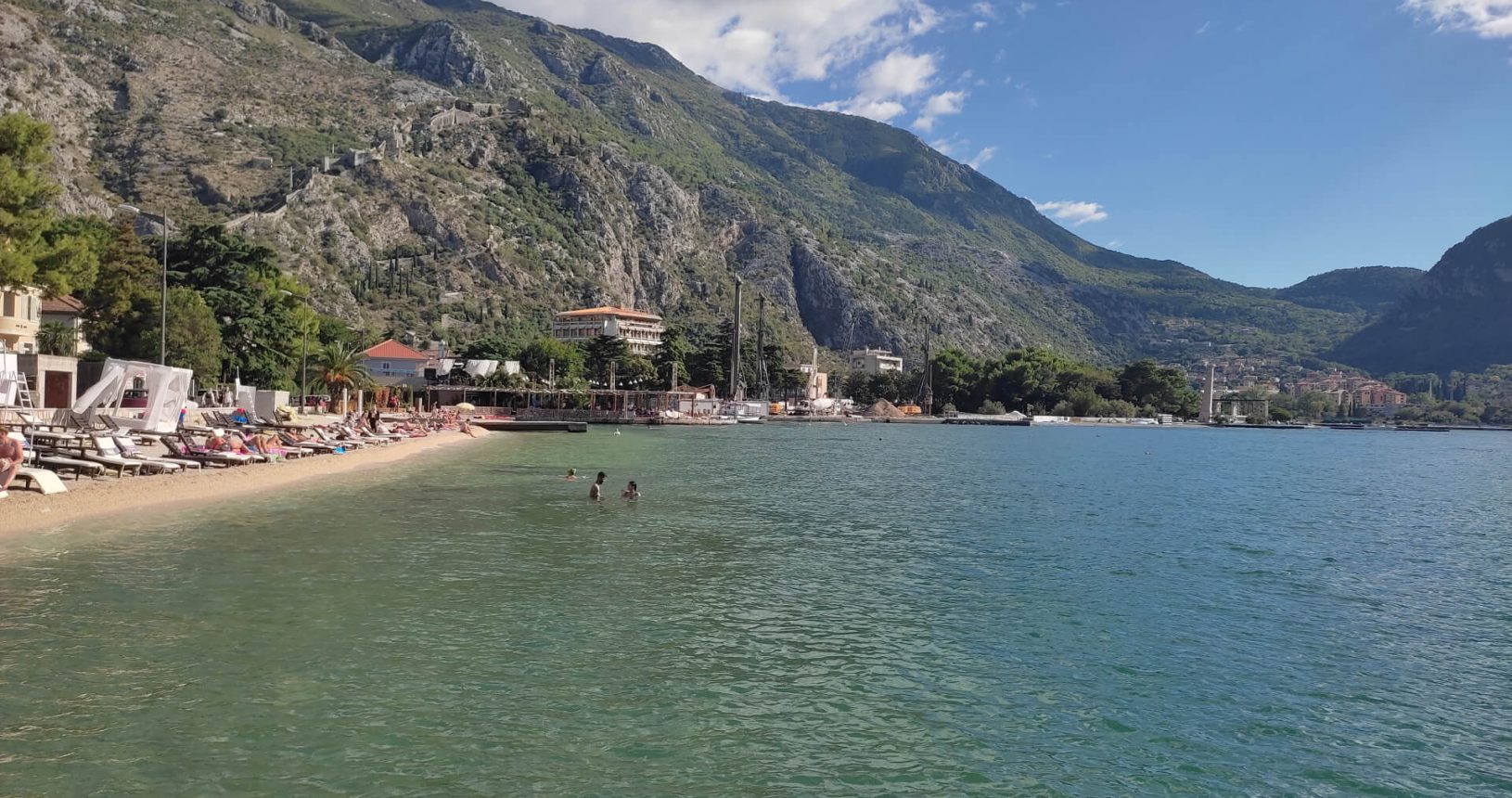 Kotor-Beach-surrounded-by-mountains